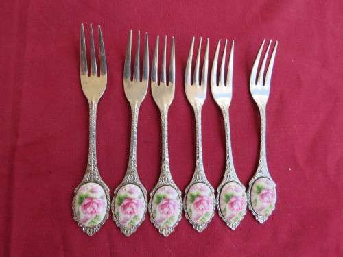 Beautiful cake forks.Set of 6 stainless steel from Japan with floral porcelain decoration.As new