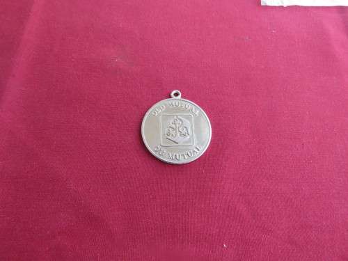 Old Mutual token in silver tone.