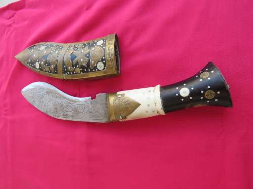 Antique Nepalese Kukri Knife.The blade is engraved.Knife is 32 cm.Good condition.