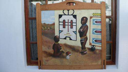 Two Zulu boys in front of their hut - original painting