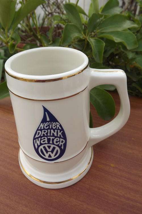 "Never Drink Water " Beermug made by Continental China Virteous.Porcelain. Gilded rims.