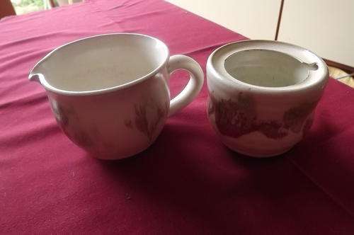 Pottery Milkjug and Sugarpot - cream with pink pattern