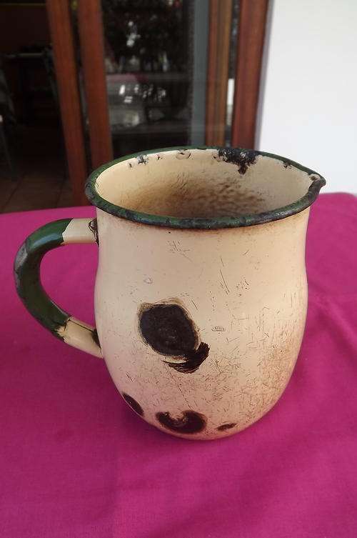 Antique Beige & Green Enamel Jug - very old and used a log - height - 15.5cm
