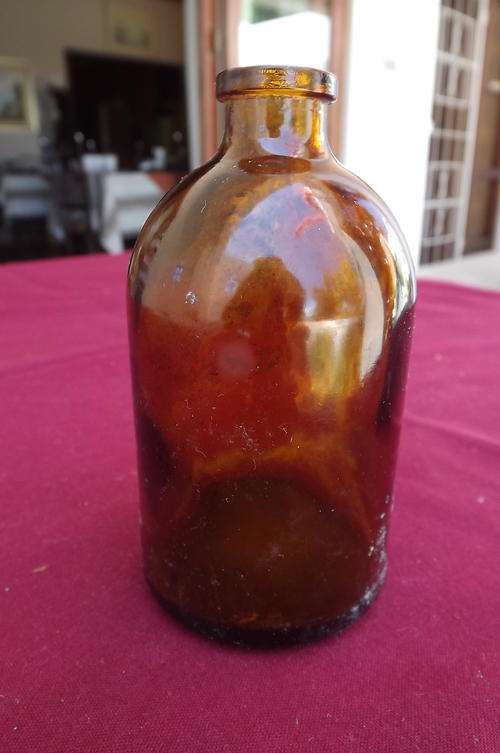Old Brown Bottle in good condition - 2.25cm tall - ISO II 21 written at the bottom