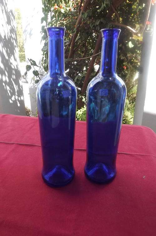 Pair of 2 Tall Bottles in Blue Glass - very good condition - height 30.5cm