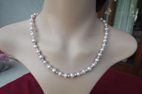 Very pretty string cultivated pearls with small pink ones and some pinkish small glass beads.45cm
