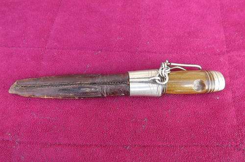 Unique antique knife in embossed leather sheath.Silver decoration on knife and sheath.Blade used exc