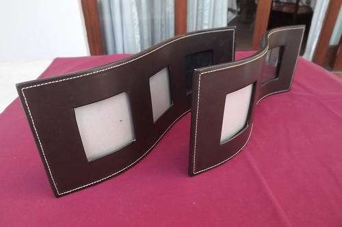 Two by Faux leather standing frames.Can take 3 photos each 33cm long.Good condition