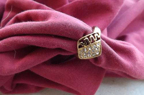 Pretty plated ring with simulated diamonds.Size 8