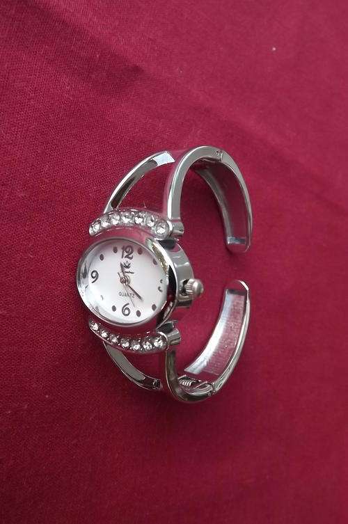 Ladies bangle type Kratree quartz watch made in China.Oval face with stones.New condition.Not used.