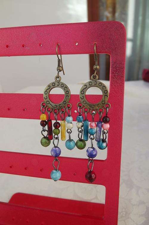 Pretty brass piercing earrings with hanging beads.New-never used