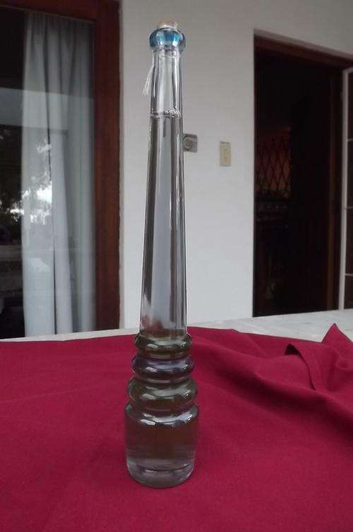Pretty tall corked bottle with coloured base.Unopened.Can be bath soap inside? 50mm 10cl at bottom.