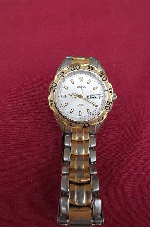 Lanco Men's watch with day and date.5 ATM.Stainless Steel strap.In good working condition