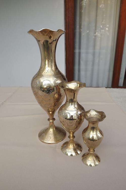 Set of 3 beautiful brass engraved vases in good condition.Heights 25 cm , 15 cm and 10.5 cm