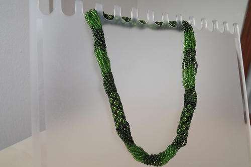 Multi string dark green very pretty necklace made up in tiny beads.Length 46cm.As new