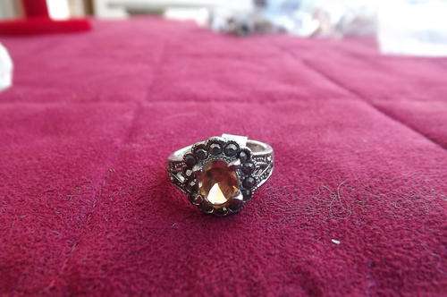 Beautiful ring in size 6 with  possibly marcasite and amber stone.No markings.
