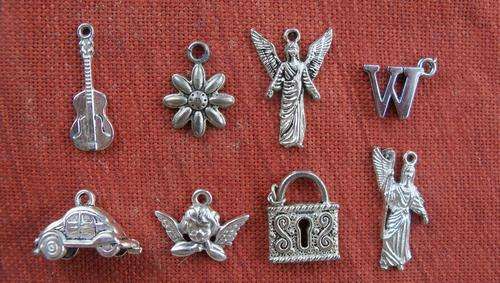 Lot of 8 Silver Charms ( no markings) as per scan