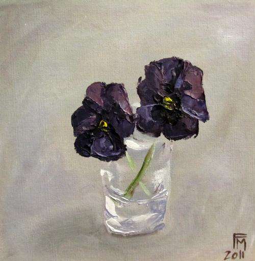 Purple Pansies in a glass vase