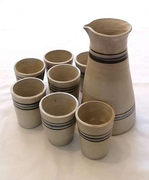 Beautiful, Modern hand-thrown set of ceramic drinking tumblers and carafe