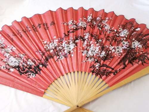 Extra Large, decorative, Chinese wall fan. Red with blooming cherry branch and Chinese characters.