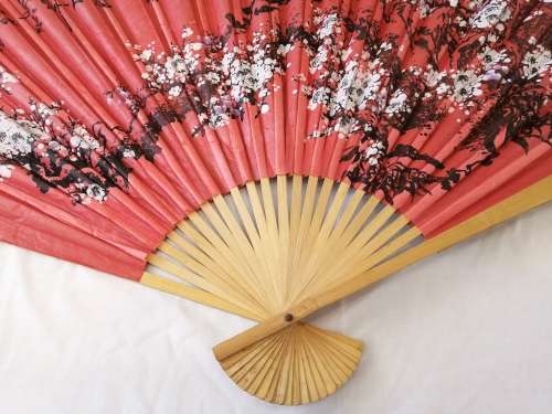 Extra Large, decorative, Chinese wall fan. Red with blooming cherry branch and Chinese characters.