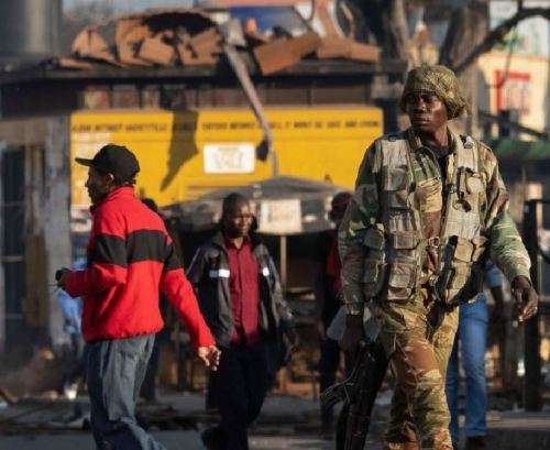 a scarce and rarely seen outside Zim - Commando Bn Battle-jacket olive green canvas - almost impossi