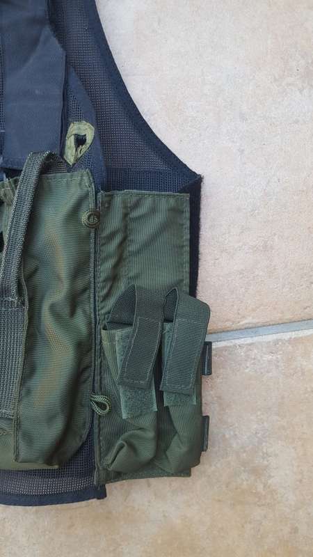 pre-1992 era SAP STF olive green urban assault vest with 2 x MP5 SMG mags ammo panel in good used co
