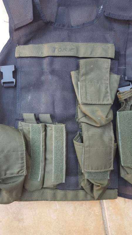 pre-1992 era SAP STF olive green urban assault vest with 2 x MP5 SMG mags ammo panel in good used co