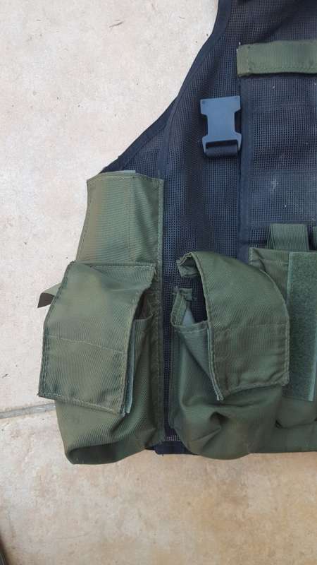 pre-1992 era SAP STF olive green urban assault vest with 2 x MP5 SMG mags ammo panel in good used co