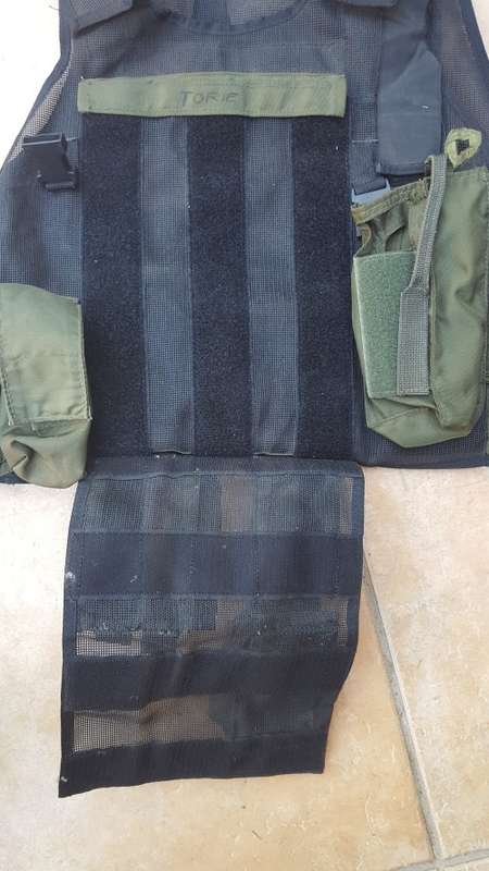 pre-1992 era SAP STF olive green urban assault vest with 2 x MP5 SMG mags ammo panel in good used co
