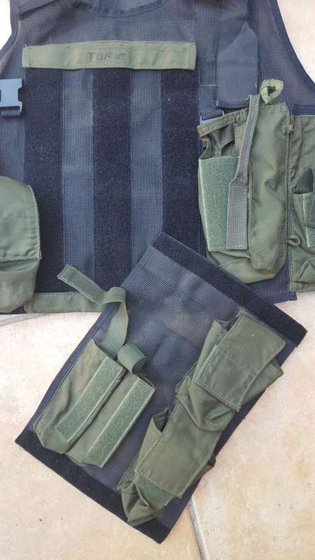 pre-1992 era SAP STF olive green urban assault vest with 2 x MP5 SMG mags ammo panel in good used co