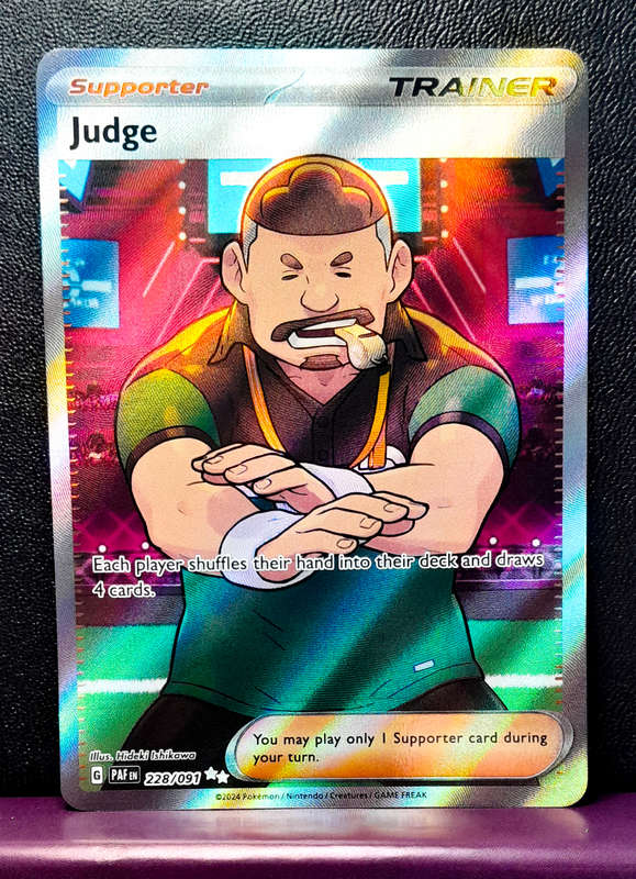 Pokemon Card - Judge 228/091 - Secret Rare Full Art Trainer - Paldean Fates