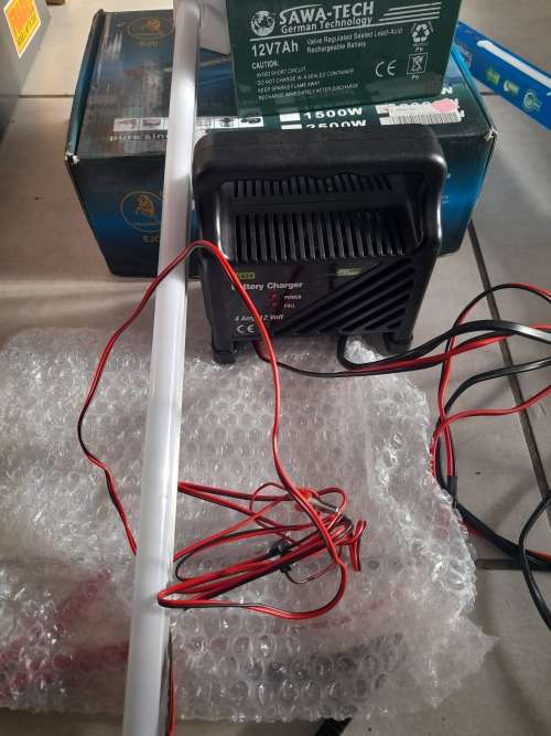 ***LOT OF OFF THE GRID SUPPLIES**2000W INVERTER(FAULTY), BATTERY CHARGER, NEW BATTERY, 12V LED LIGHT