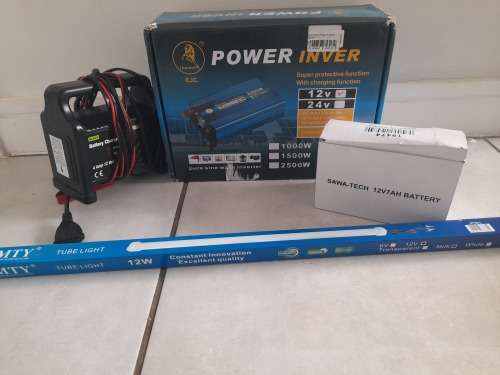 ***LOT OF OFF THE GRID SUPPLIES**2000W INVERTER(FAULTY), BATTERY CHARGER, NEW BATTERY, 12V LED LIGHT