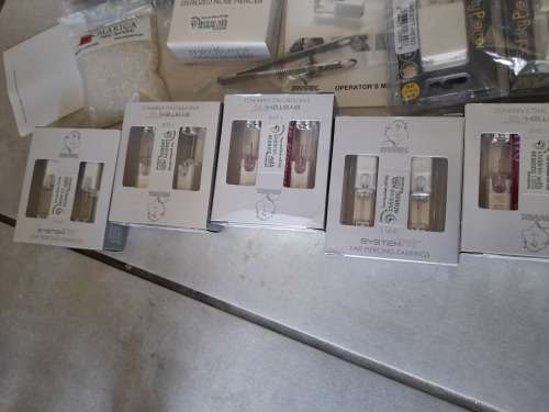 *LIQUIDATION*COMPLETE STUDEX BODY PIERCING BUSINESS*PIERCING GUNS,STUDS,IMDEMNITY FORMS,ETC ETC**