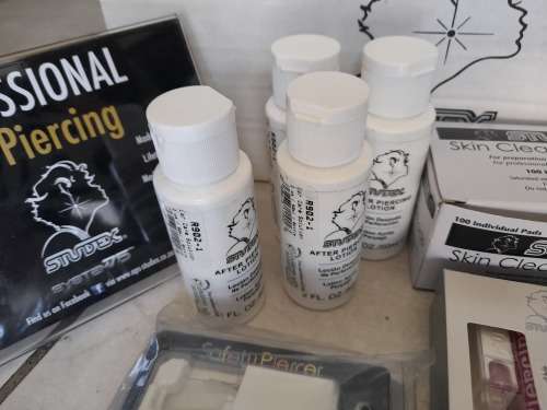 *LIQUIDATION*COMPLETE STUDEX BODY PIERCING BUSINESS*PIERCING GUNS,STUDS,IMDEMNITY FORMS,ETC ETC**