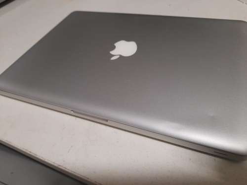 **MONTH END MADNESS*APPLE MAC BOOK PRO*NO CHARER NOT SURE SPECS*CRACKED SCREEN**