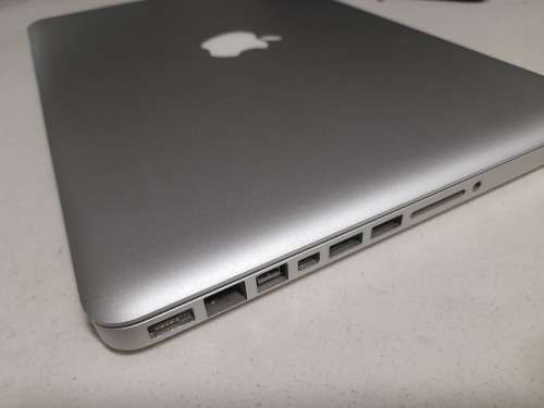 **MONTH END MADNESS*APPLE MAC BOOK PRO*NO CHARER NOT SURE SPECS*CRACKED SCREEN**