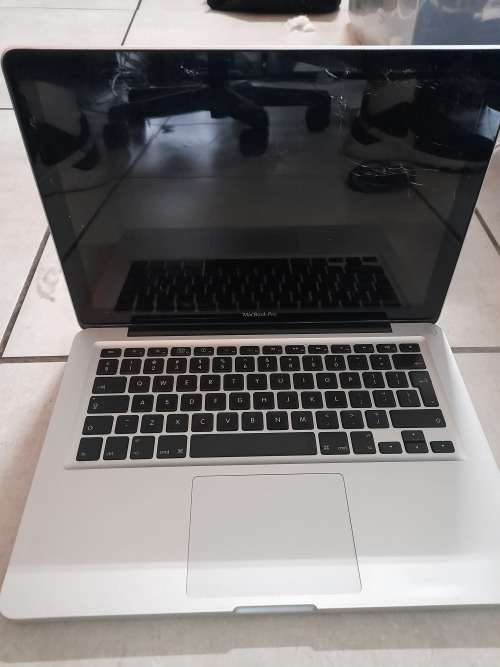 **MONTH END MADNESS*APPLE MAC BOOK PRO*NO CHARER NOT SURE SPECS*CRACKED SCREEN**