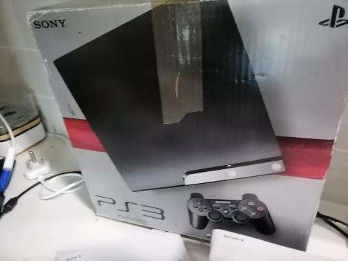 *PREOWNED SONY PLAYSTATION 3 IN BOX WITH 2 GAMES* 1 NEW WIRELESS REMOTE*1 USED REMOTE,MANUALS*