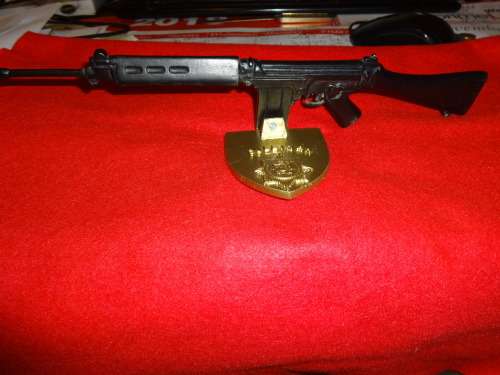 R1 RIFLE MOUNTED ON OLD SOUTH AFRICAN POLICE BADGE
