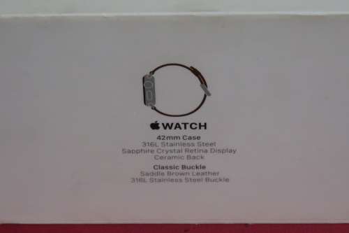 Apple watch 42mm case with all the parts and papers that come with it.