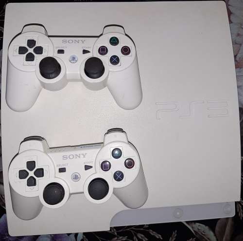 Playstation 3 with 2 controls and 9 games