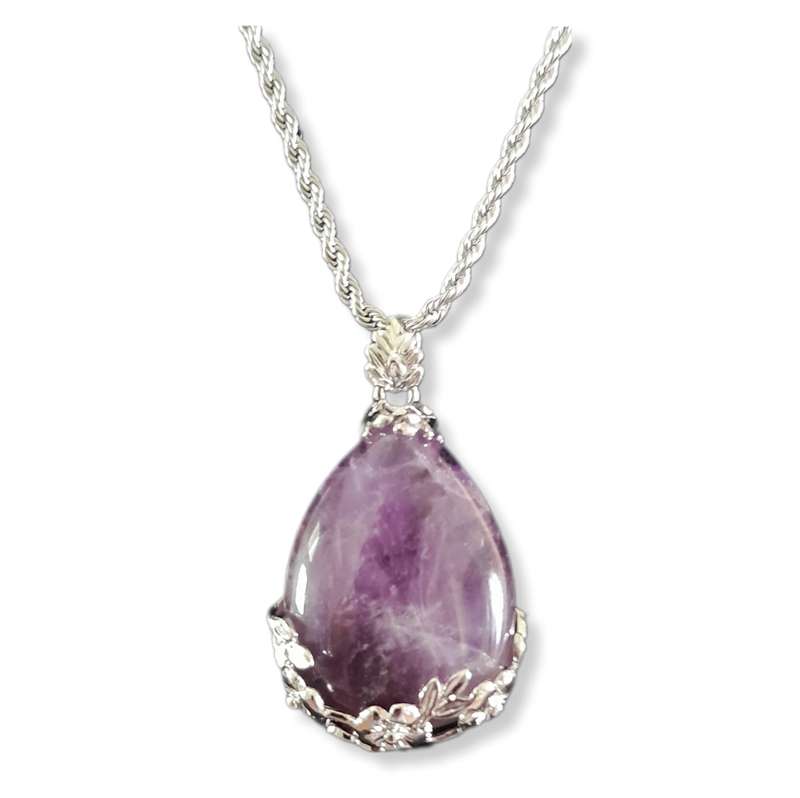 Natural tear-drop gemstone with intricate metal flower design