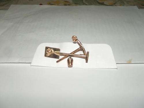 Gold brooch with 2 gold nuggets on spade and pick 5.5 gram gold were used.Made app 1920