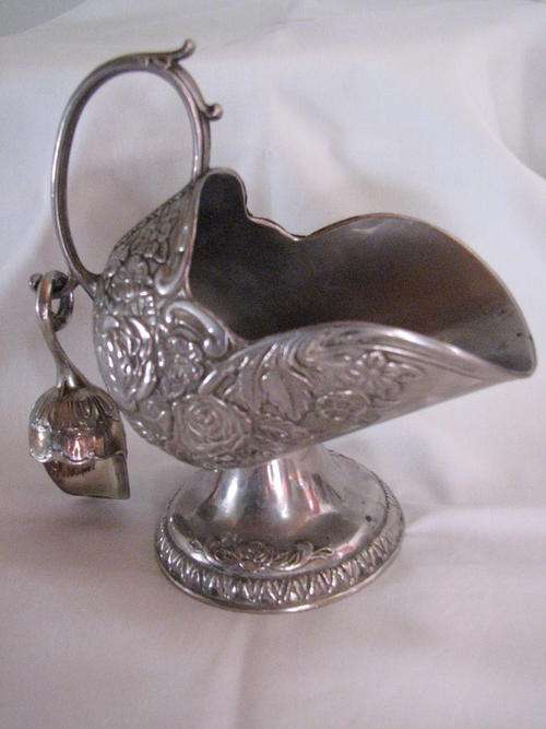 Sugar bowl and small spoon