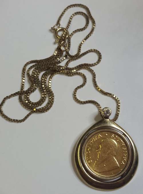 STUNNING 1/10TH KRUGER COIN IN PENDANT WITH DIAMOND ON 9CT GOLD CHAIN STUNNING