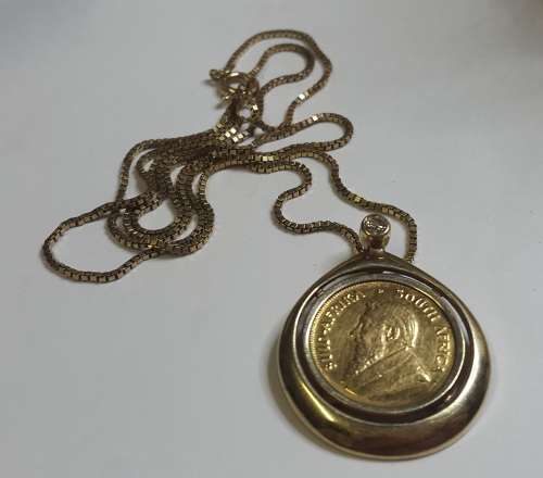 STUNNING 1/10TH KRUGER COIN IN PENDANT WITH DIAMOND ON 9CT GOLD CHAIN STUNNING