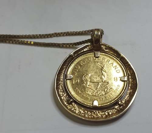 STUNNING 1/10TH KRUGER COIN IN PENDANT WITH DIAMOND ON 9CT GOLD CHAIN STUNNING
