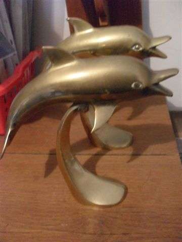 A PAIR OF BRASS DOLPHINS....